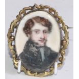 English School, an early 19th century, an oval portrait miniature on ivory, young gentleman in black