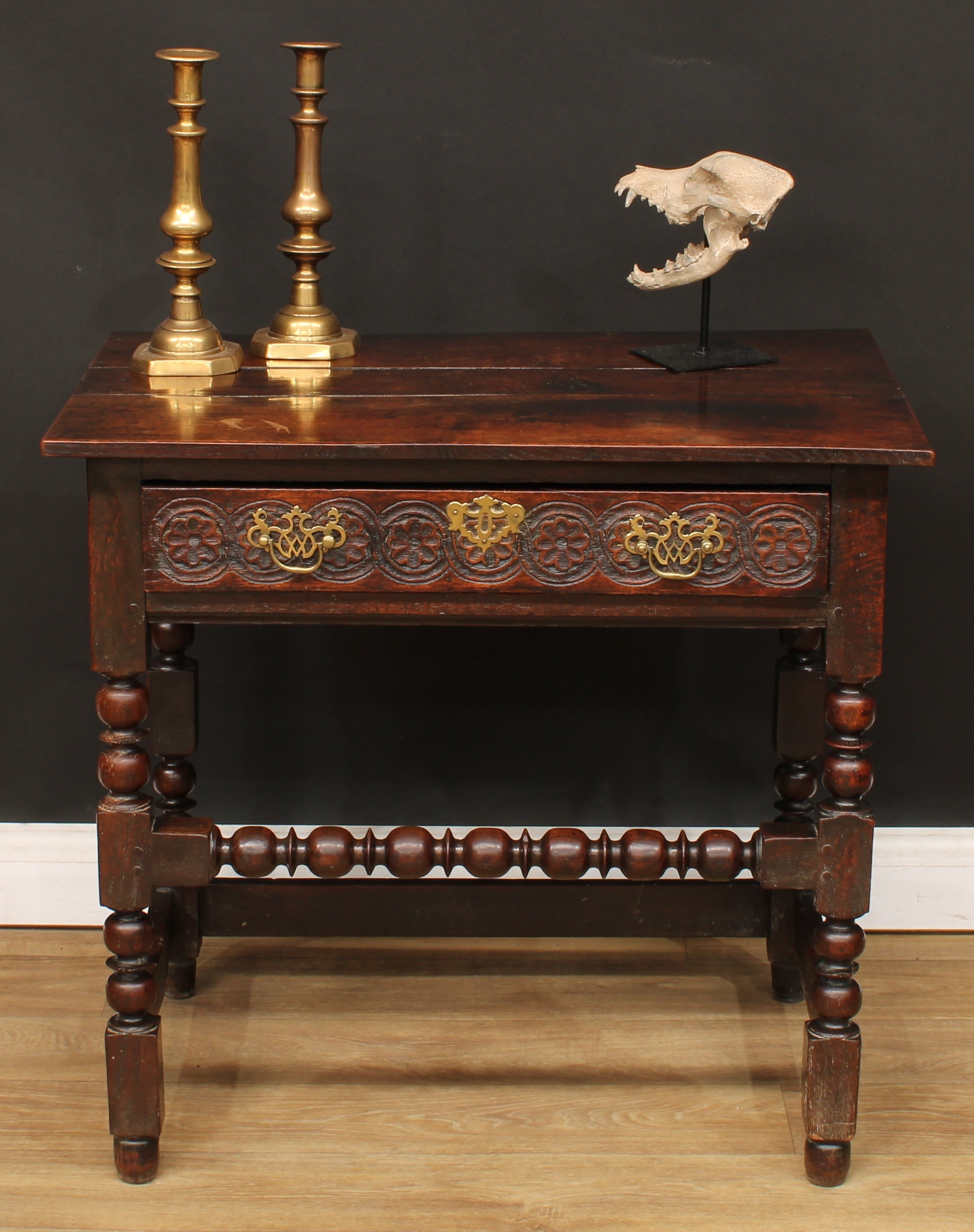 An 18th century oak side table, planked rectangular top above a long frieze drawer, the front