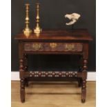 An 18th century oak side table, planked rectangular top above a long frieze drawer, the front
