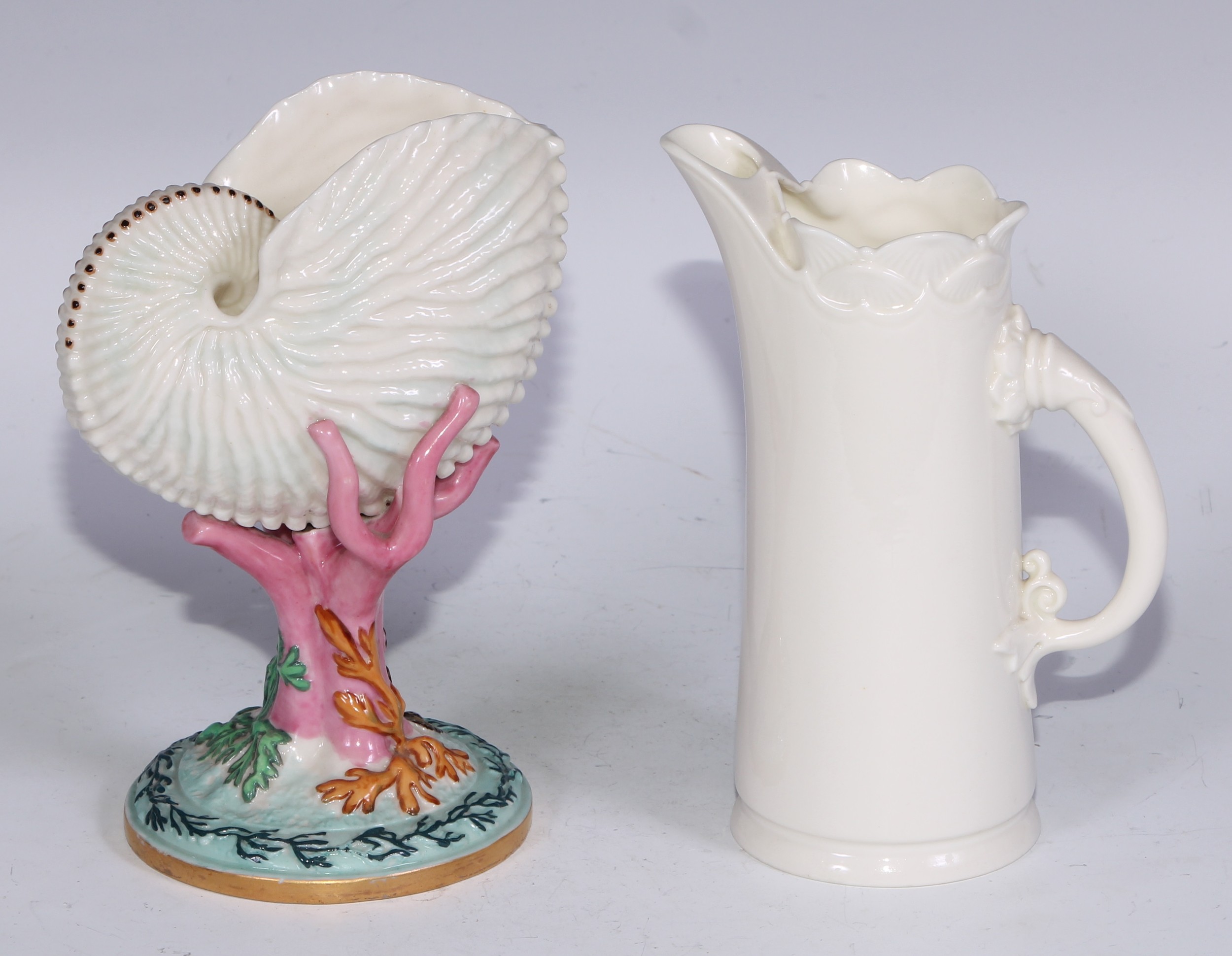 A Royal Worcester vase, naturalistically modelled as a nautilus shell upon a coral specimen, 16cm