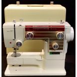 A New Home electric sewing machine, cased, etc