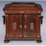 A George IV rosewood and mother of pearl sarcophagus table cabinet, hinged cover above a pair of