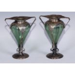 A pair of Art Nouveau silver mantel vases, canted angular handles, whiplash-pierced mounts, circilar