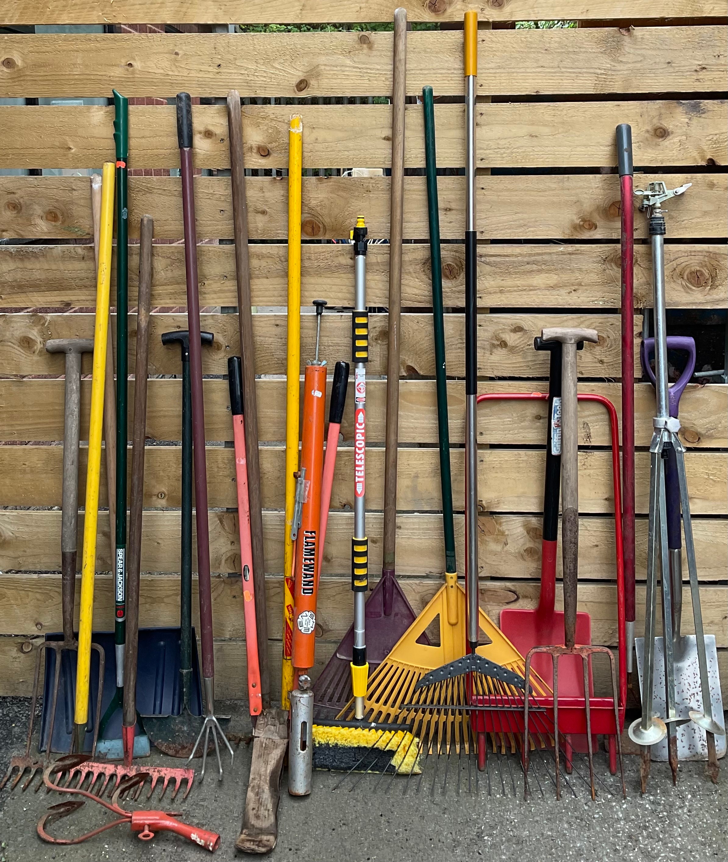 Garden Tools - a Sheen Flamewand; a high-rise tripod sprinkler; a hollow tine lawn aerator; spade;