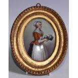 A German oval porcelain plaque, with a lady carrying a tray, 11cm x 8cm, gilt frame