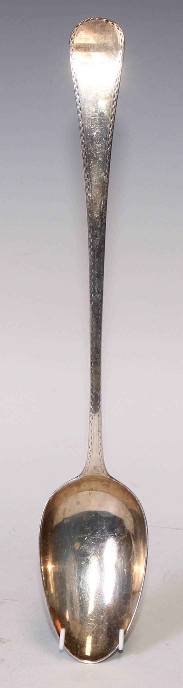 A George III silver Bright-cut Old English pattern basting spoon, 30cm long, London 1786; another, - Bild 3 aus 5