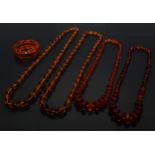 A graduated deep orangy amber coloured resin faceted block bead necklace, beads ranging between