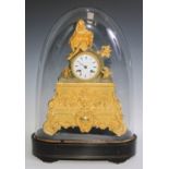 A 19th century gilt metal mantel clock, 8cm enamel dial inscribed with Roman numerals, twin-