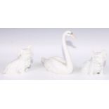 A pair of Vienna Bolognese Terriers, in the white, model no.1631; a Lladro swan