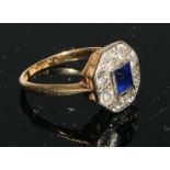 An Art Deco octagonal sapphire and diamond cluster, the central square cushion cut sapphire within