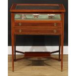 An Edwardian satinwood crossbanded mahogany bijouterie table, hinged rectangular top above a pair of