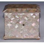 A Victorian mother of pearl dressing table cabinet, sarcophagus top above a pair of rectangular