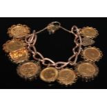 A nine coin 9ct gold chain link bracelet, comprising sovereigns 1910, 1880, 1893, 1967, 1900 and