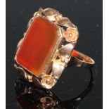 A Russian 14ct gold ring, the large tablet set with a canted rectangular agate panel, within