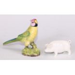 A Sampson Hancock model, of a pig, in the white, 8.5cm long, blue mark; a bird, 11cm high, red