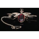 A Victorian diamond set insect brooch, the thorax and wings set with old cut diamonds, red stone