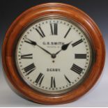 A large early 20th century oak circular wall timepiece, the 41cm painted clock dial inscribed G S
