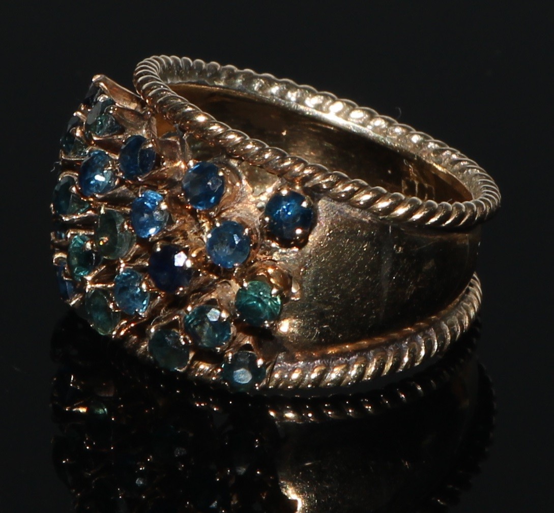 A sapphire cluster ring, arched tapering shank adorned with twenty three blue sapphires, yellow - Image 2 of 2