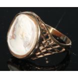 A 9ct gold and shell cameo signet ring, carved with a classical beauty, bezel mount, lattice