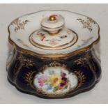A Meissen lobed circular inkwell and cover, decorated with reserves of summer flowers, picked out in