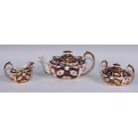 A Royal Crown Derby 2451 pattern three piece tea service, comprising teapot, milk jug and sucrier,
