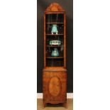A George I style walnut display cabinet, of narrow proportions, arched top above a glazed door