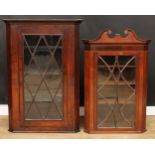 A George III oak splay front corner display cabinet, 124cm high, 84.5cm wide, 46cm deep; another,