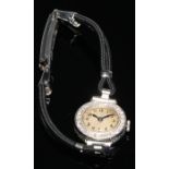 A ladies diamond set white metal cocktail watch, the small silver dial with Arabic numerals, diamond