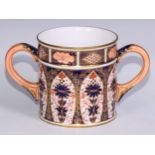 A large Derby Crown Porcelain 1128 pattern two handled loving cup, peach scroll handles, 14cm