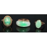 A 14ct gold and jadeite ring, set with an oversized curved rectangular panel, the mount and