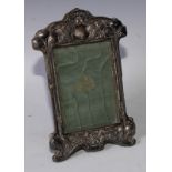 An Edwardian silver Art Nouveau easel photograph frame, embossed decoration with a pair of pheasants