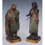 A pair of Goldscheider Orientalist terracotta figures, of an Arab lady and gentleman, , 38.5cm high,