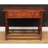 An oak side table, slightly oversailing top above a long frieze drawer, the front inlaid in the