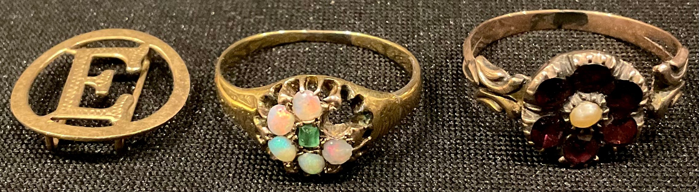 An unmarked 9ct gold polished opal and emerald cluster ring, size N, late 19th century, another
