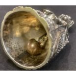 An unusual 19th century silver plated figural table bell, cast as a lady with a nodding head, 11cm
