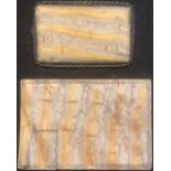 A rectangular mammoth tooth brooch, the panel as a transverse section, rope twist border, 6cm