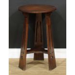 An Arts & Crafts oak occasional table, in the manner of Liberty & Co, 68.5cm high, the top 43cm