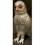 A large silver plated novelty caster, as an owl, 15cm high