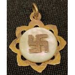 A 9ct rose gold and mother-of-pearl pendant, set with a swastika good luck symbol, marked 9ct, 1.2g,