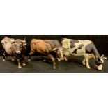 A large C. Martinu continental porcelain model of a bull, 36cm long; others, cows (3)