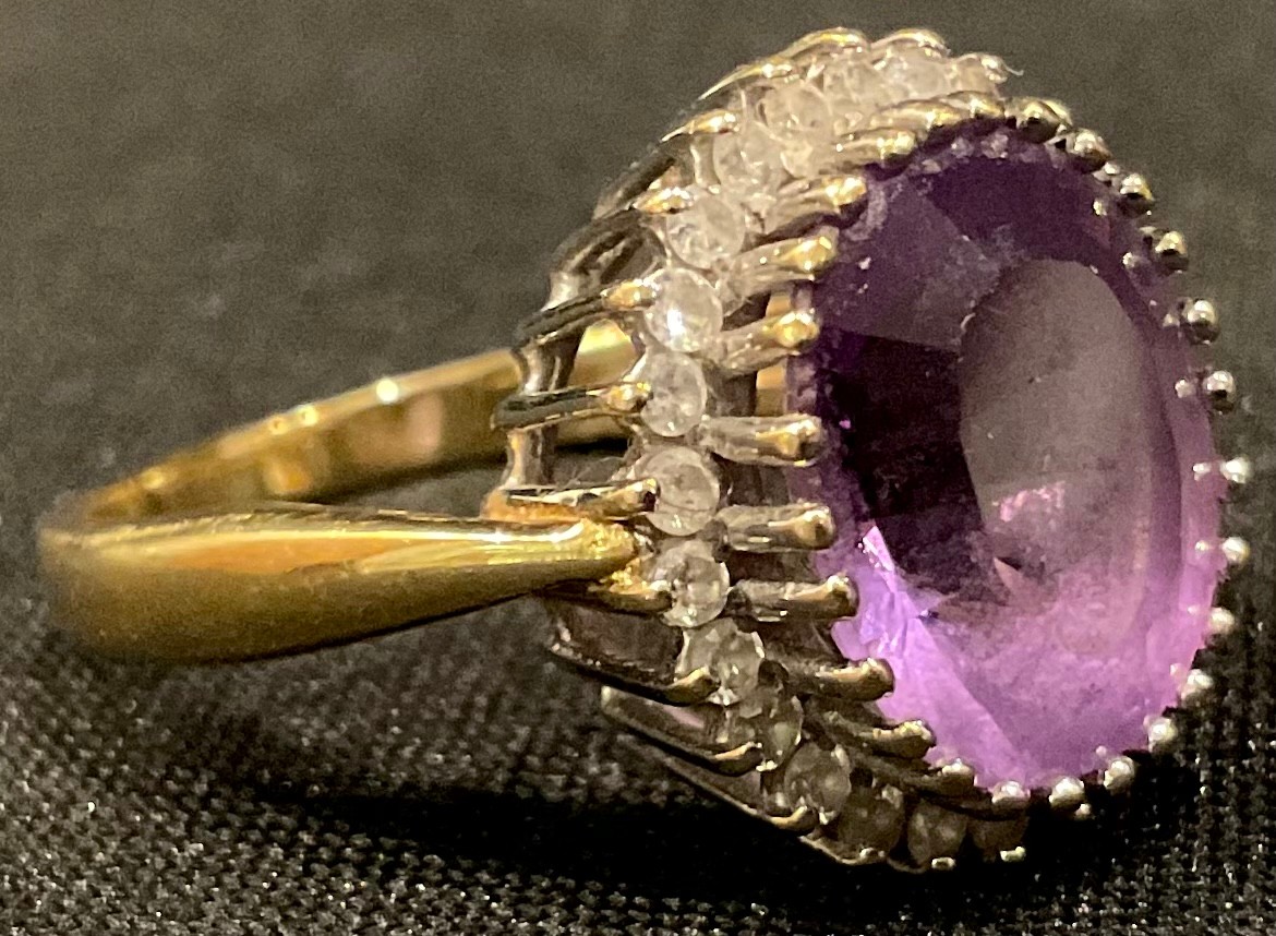 An 18ct gold amethyst and diamond ring, size P/Q, 6.5g
