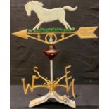 A cast metal weather vane, surmounted with a white horse, metal bracket, 58cm overall