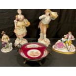 A pair of Continental porcelain figures, flower girl and fruit picker, 31cm high; a figure group,