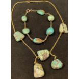 A 9ct gold and turquoise necklace, ruff cut stones; a 9ct gold and turquoise conforming bracelet (