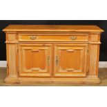 A 19th century style pine low dresser or side cabinet, moulded oversailing top above a long frieze