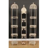 A pair of architectural stamped metal four-tier plant display stands, 202cm high, each plateau 33.