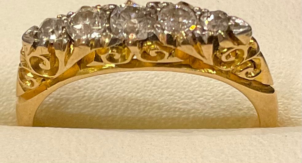 An 18ct gold five stone graduated diamond ring, size L, 3.2g; a 9ct gold eternity ring, unmarked, - Bild 2 aus 3