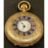 A Edwardian gold plated half hunter pocket watch, the cover engraved and chased with stiff leaves,