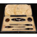 A Mappin & Webb silver and tortoiseshell manicure set, fitted case, Birmingham 1928