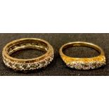 An 18ct gold five stone graduated diamond ring, size L, 3.2g; a 9ct gold eternity ring, unmarked,
